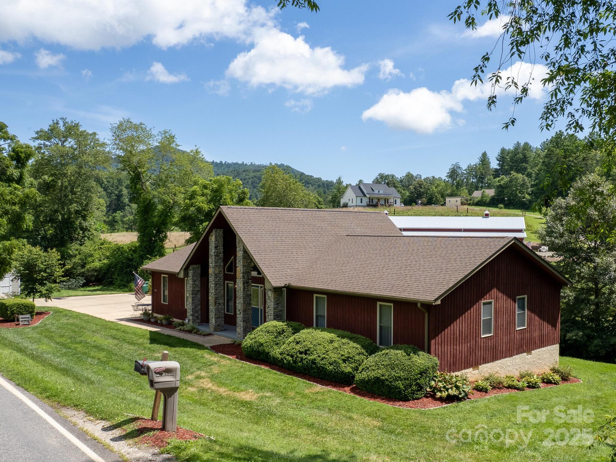 20 Brooks Cove Road Candler, NC 28715 - Photo 3 of 43 a aerial view of a house in the garden