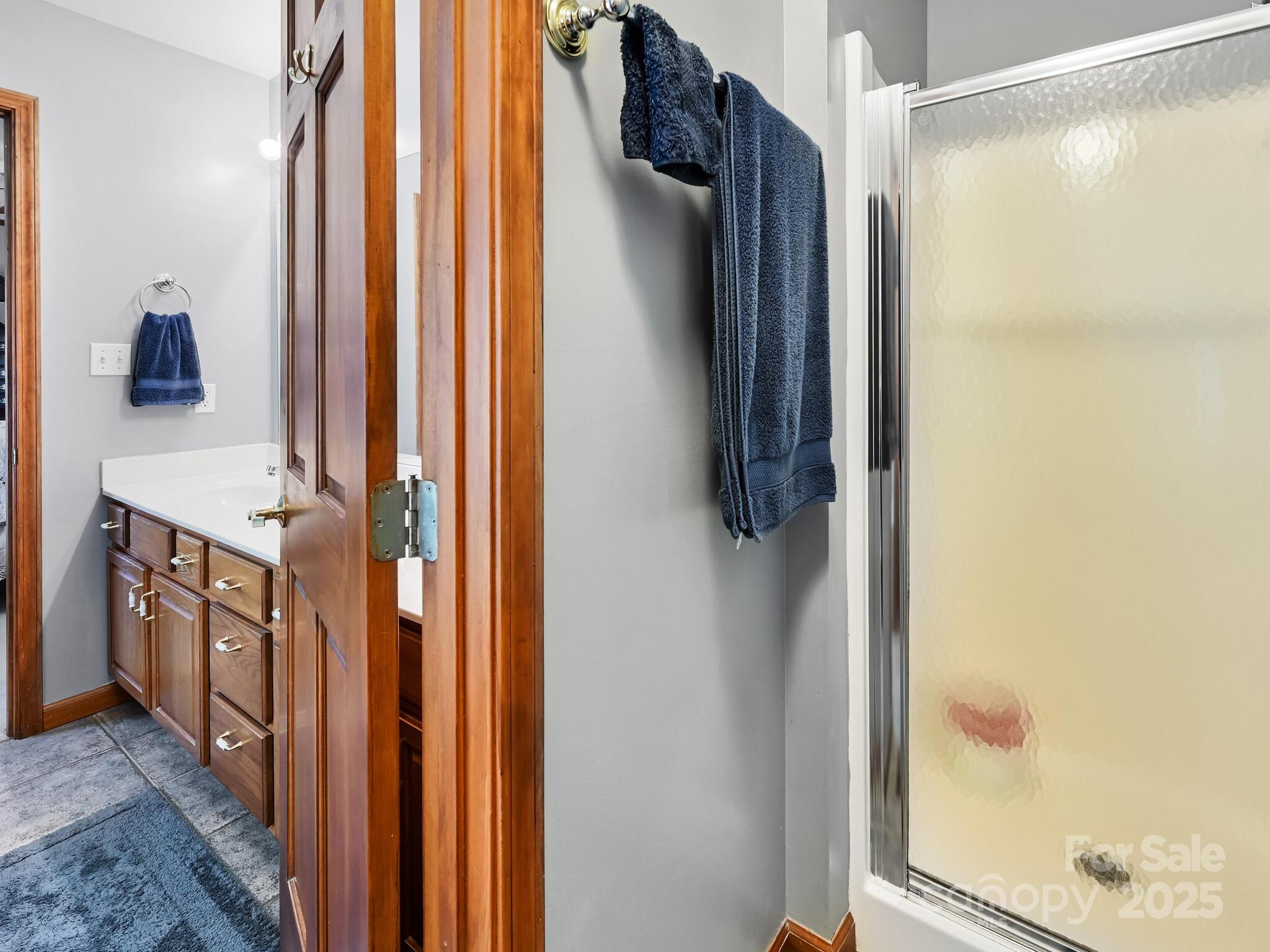 20 Brooks Cove Road Candler, NC 28715 - Photo 34 of 43 a bathroom with a shower and a sink