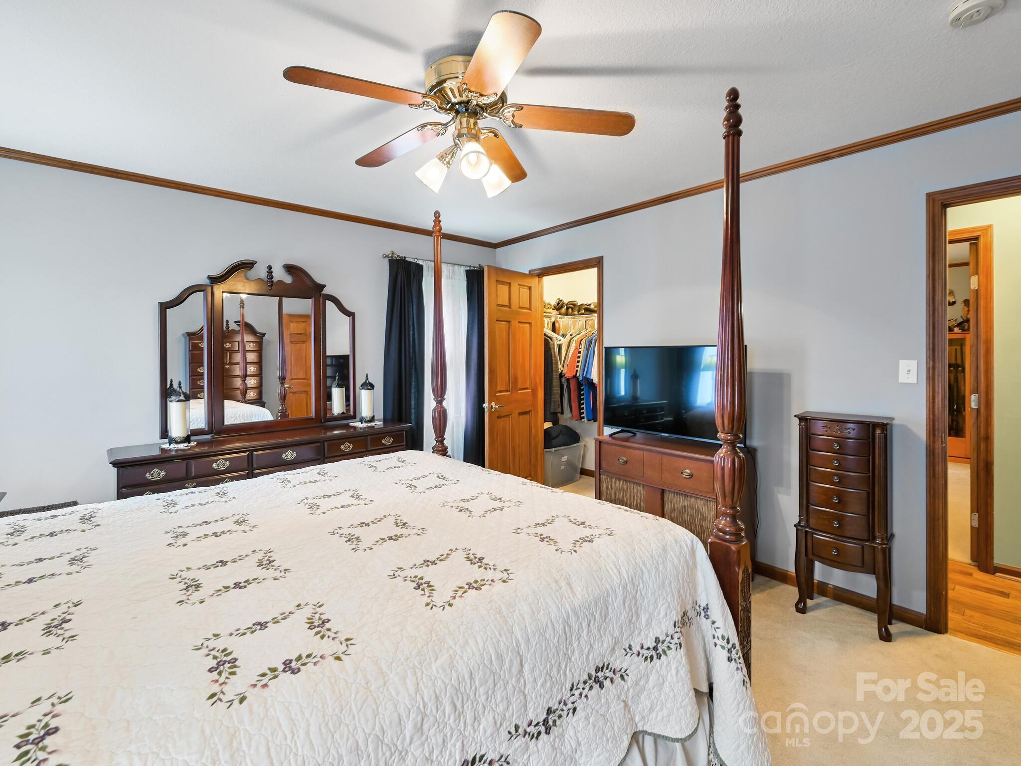 20 Brooks Cove Road Candler, NC 28715 - Photo 36 of 43 a bedroom with a bed and a flat tv screen on dresser