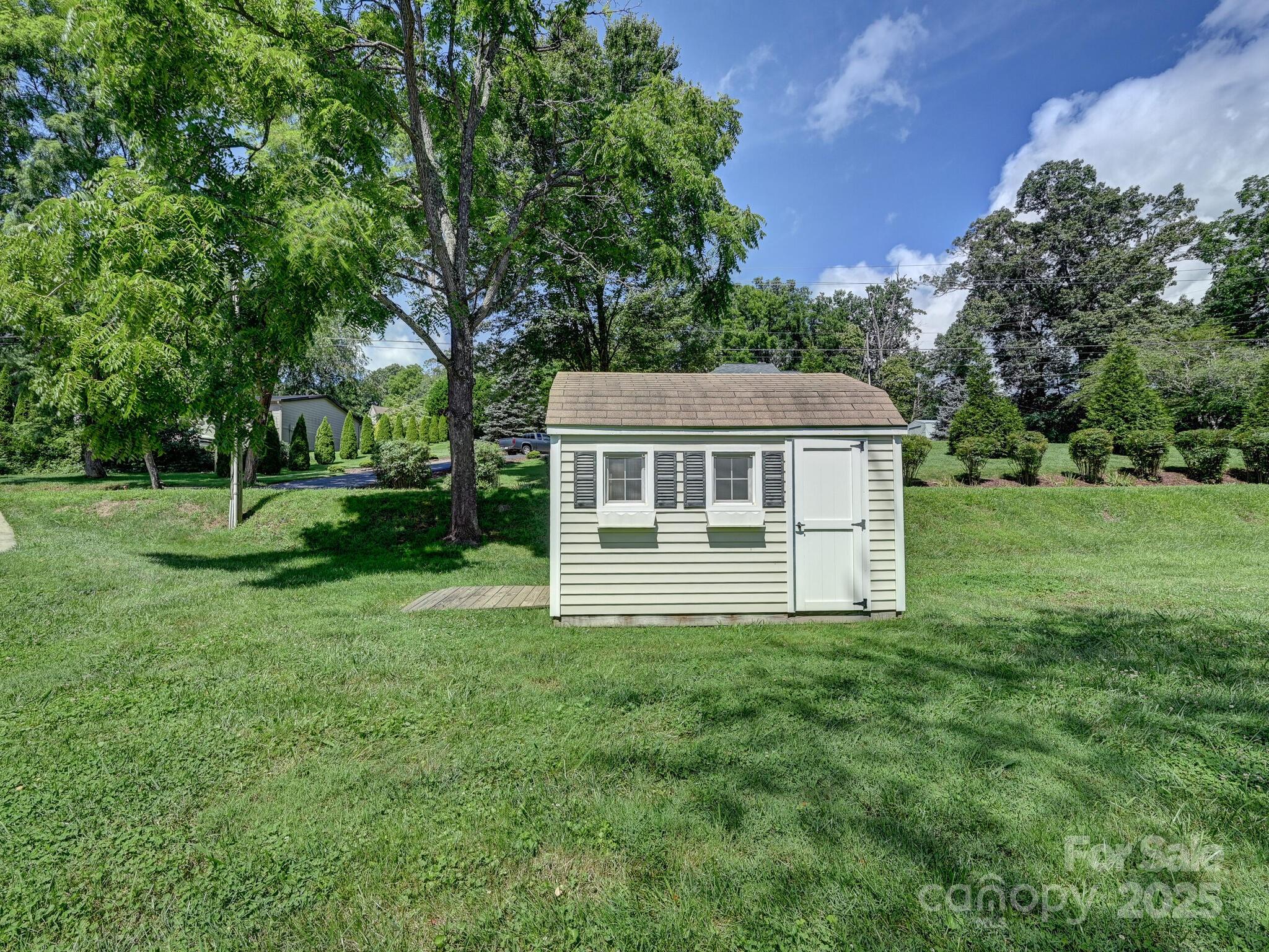 20 Brooks Cove Road Candler, NC 28715 - Photo 38 of 43 a front view of a house with yard and green space