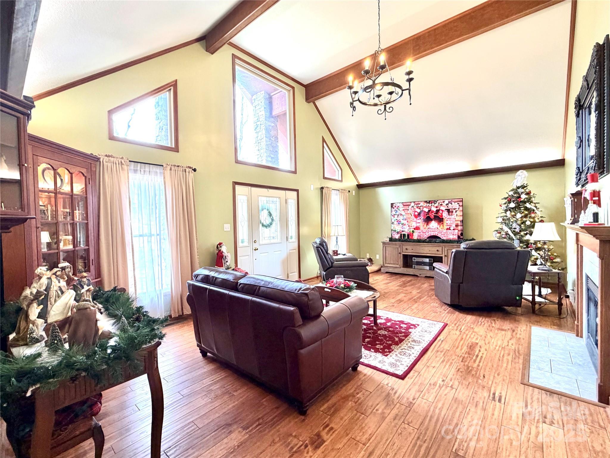 20 Brooks Cove Road Candler, NC 28715 - Photo 5 of 43 a living room with furniture fireplace and a large window