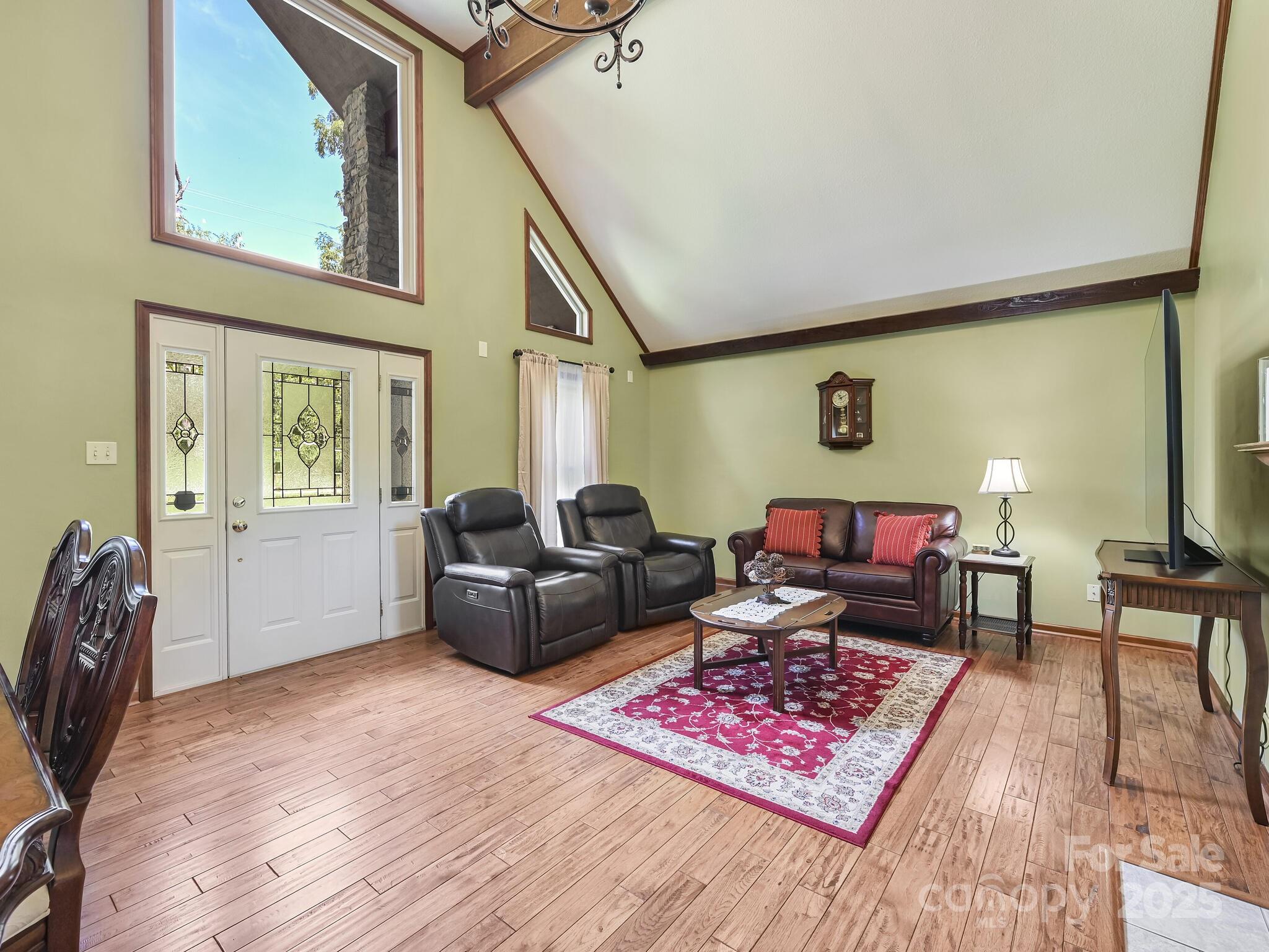 20 Brooks Cove Road Candler, NC 28715 - Photo 8 of 43 a living room with furniture rug and wooden floor
