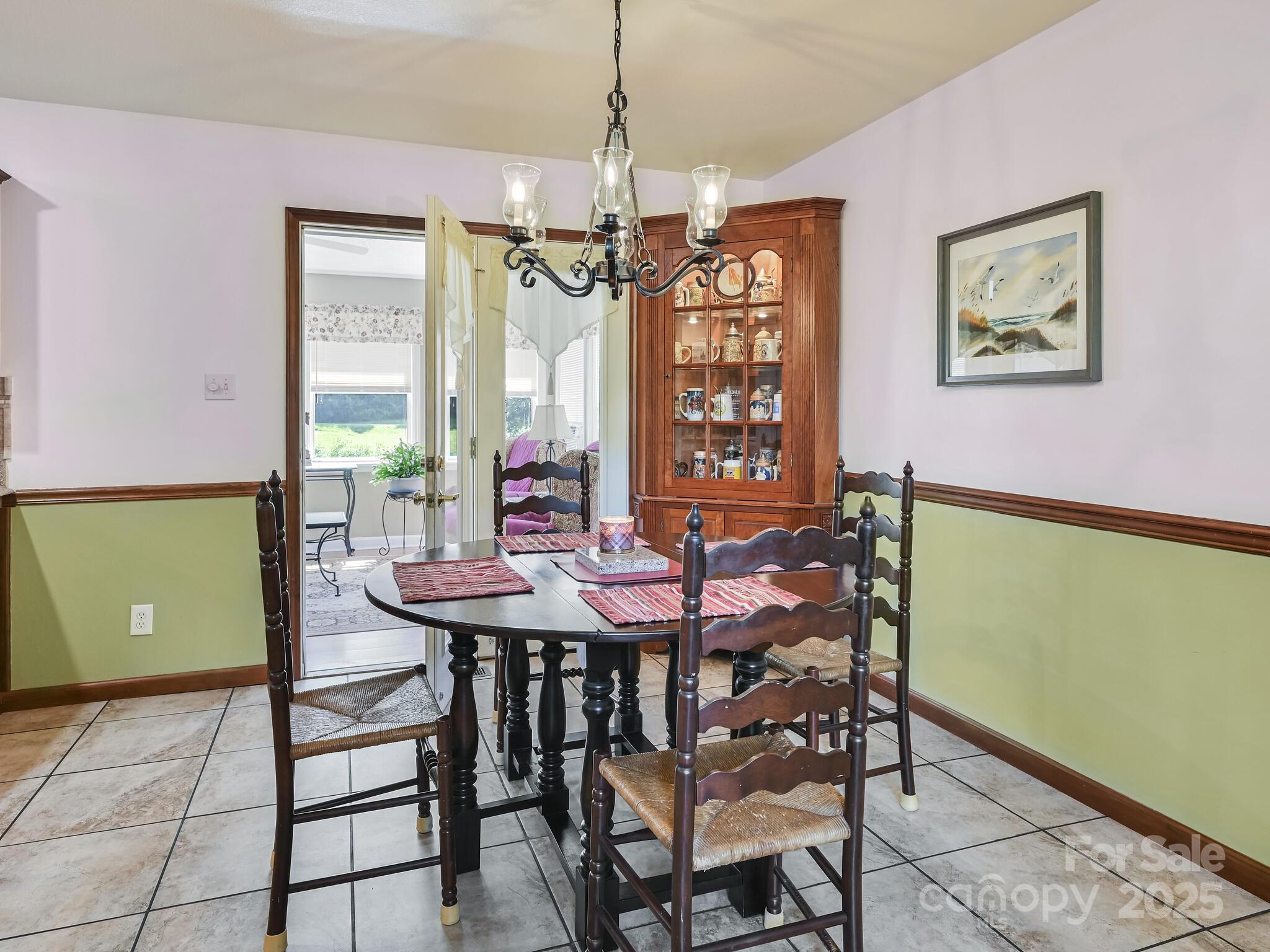 20 Brooks Cove Road Candler, NC 28715 - Photo 10 of 43 a view of a dining room with furniture window and wooden floor