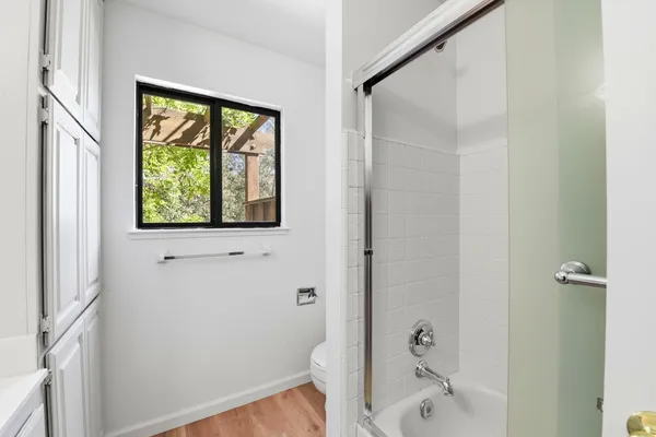 a bathroom with a bathtub and a shower