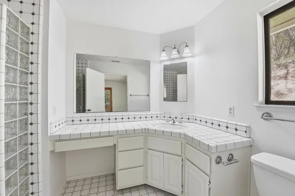 a bathroom with a sink and a toilet