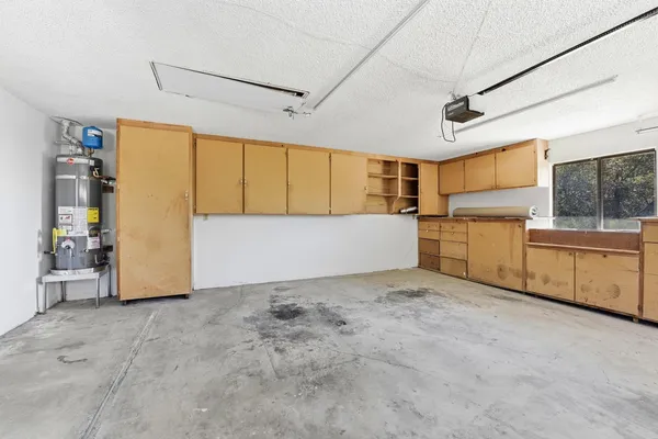 a view of a kitchen with refrigerator and dishwasher