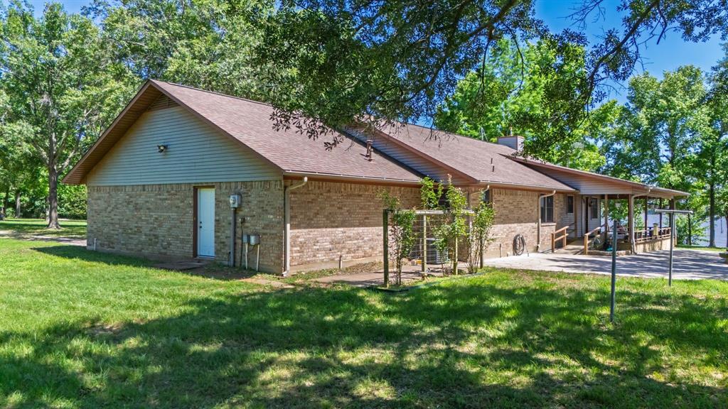 476 Private Road 7326 Emory, TX 75440 - Photo 17 of 33 a front view of a house with garden