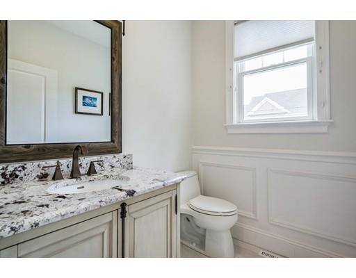 17 Ridgeway Avenue Needham, MA 02492 - Photo 14 of 30 a bathroom with a granite countertop sink a toilet and a mirror