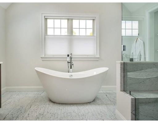 17 Ridgeway Avenue Needham, MA 02492 - Photo 17 of 30 a white bath tub sitting in a bathroom
