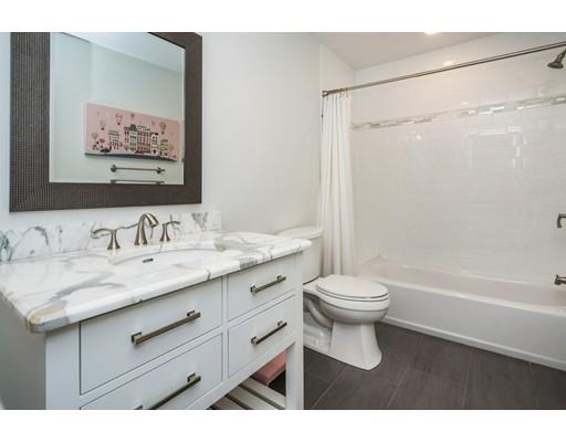 17 Ridgeway Avenue Needham, MA 02492 - Photo 21 of 30 a bathroom with a granite countertop sink toilet and shower