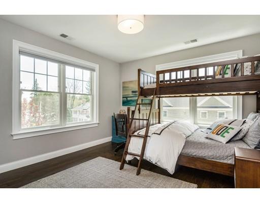17 Ridgeway Avenue Needham, MA 02492 - Photo 22 of 30 a bedroom with a bed next to a window