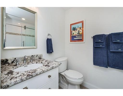 17 Ridgeway Avenue Needham, MA 02492 - Photo 25 of 30 a bathroom with a granite countertop sink mirror vanity and toilet