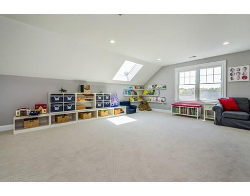 17 Ridgeway Avenue Needham, MA 02492 - Photo 26 of 30 a room with furniture and a flat screen tv