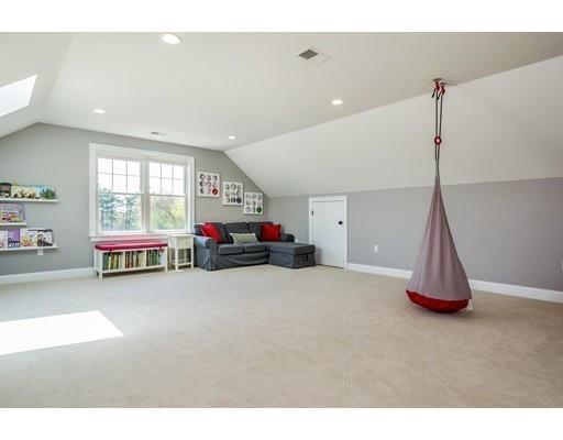 17 Ridgeway Avenue Needham, MA 02492 - Photo 27 of 30 a living room with furniture and a chandelier