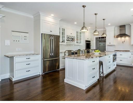 17 Ridgeway Avenue Needham, MA 02492 - Photo 3 of 30 a kitchen with stainless steel appliances kitchen island granite countertop a stove a refrigerator and a wooden floors
