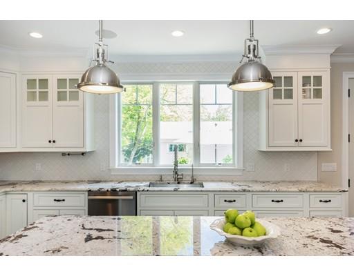 17 Ridgeway Avenue Needham, MA 02492 - Photo 4 of 30 a kitchen with kitchen island granite countertop a sink stainless steel appliances and cabinets