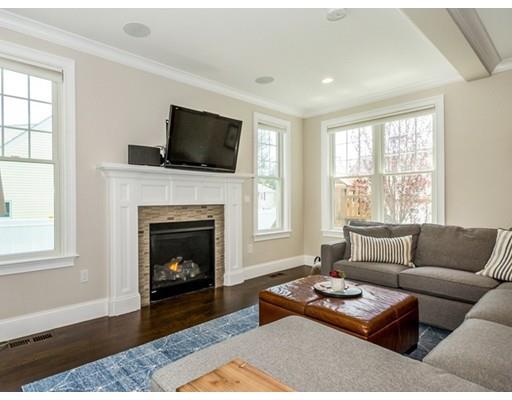 17 Ridgeway Avenue Needham, MA 02492 - Photo 10 of 30 a living room with furniture a flat screen tv and a fireplace
