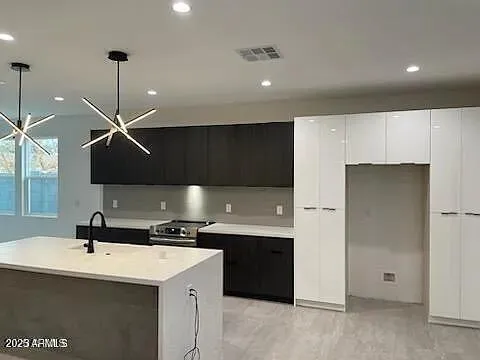 a kitchen with a sink and a refrigerator