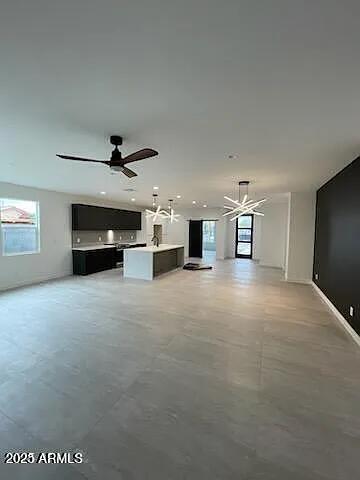 2826 North 28th Place Phoenix, AZ 85008 - Photo 6 of 8 a view of empty room with a ceiling fan and window