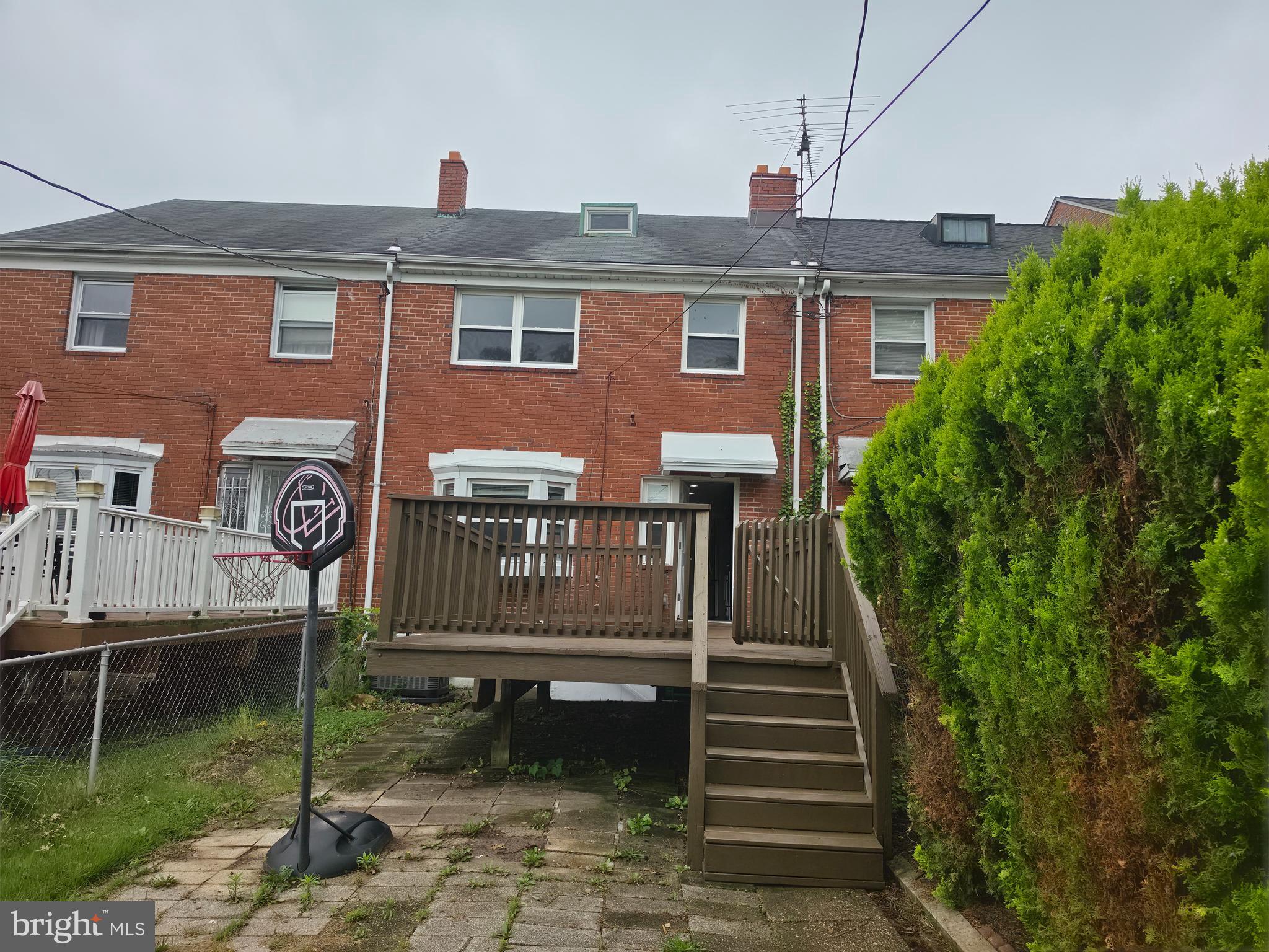 2028 Hillenwood Road Baltimore, MD 21239 - Photo 7 of 18 a front view of a house with garden
