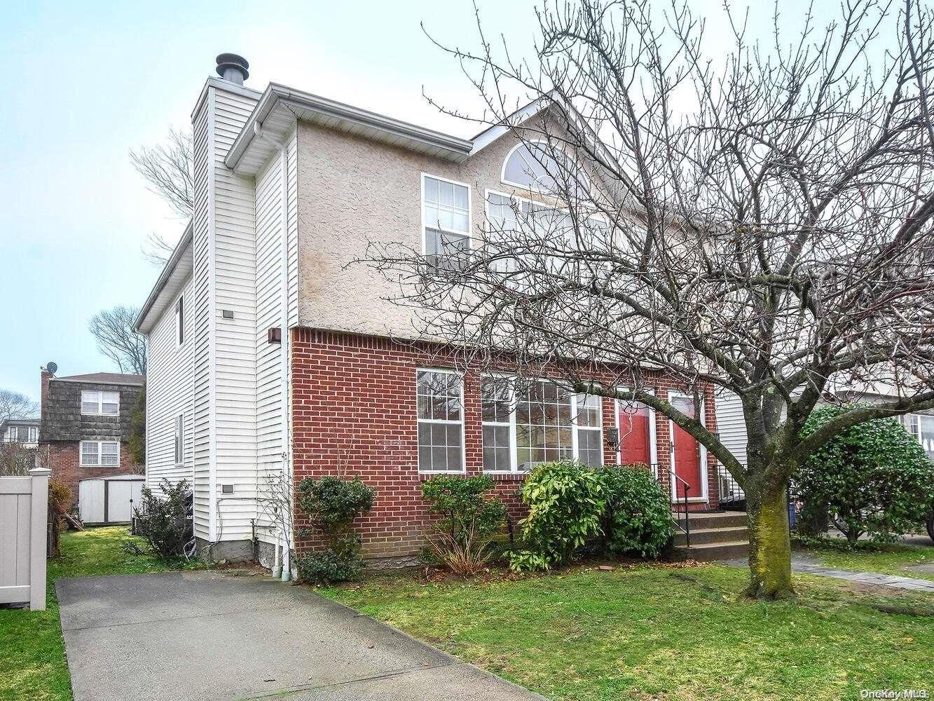 9 Hickory Road Port Washington, NY 11050 - Photo 1 of 1 a front view of a house with garden