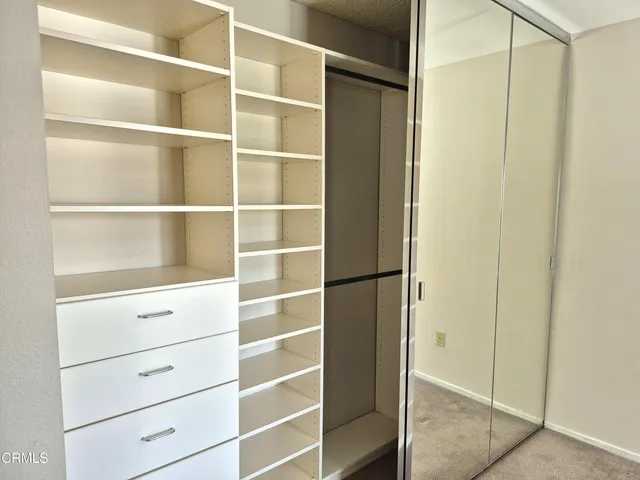 a view of an empty walk in closet