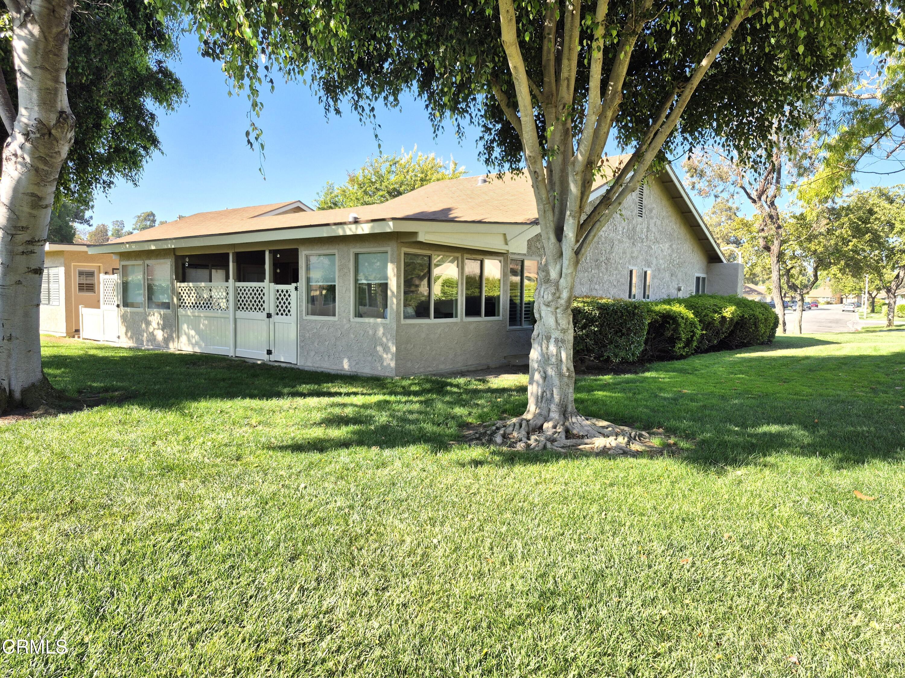 7107 Village 7 Camarillo, CA 93012 - Photo 21 of 21 a front view of a house with garden