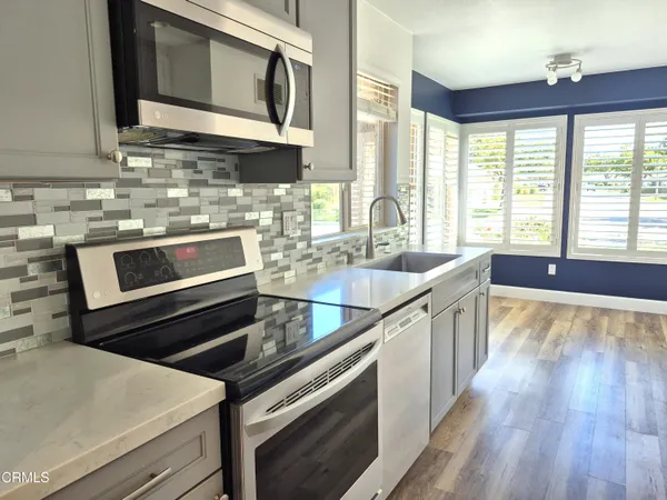 a kitchen with a stove and a sink