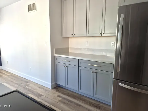 a view of cabinets and wooden floor