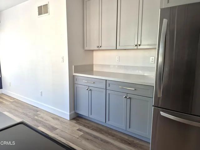 a view of cabinets and wooden floor