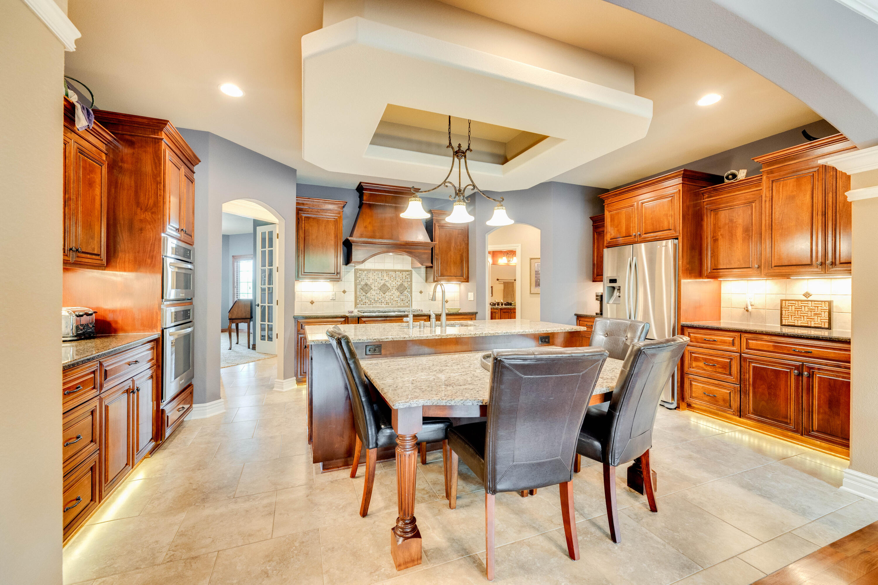 S63-w34455 Piper Road Eagle, WI 53119 - Photo 13 of 56 Two-tier granite island with seating