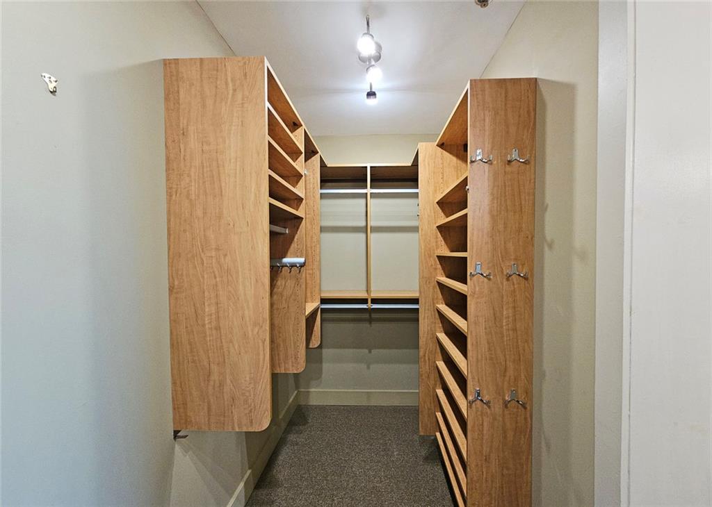 4561 Olde Perimeter Way, Unit 704 Atlanta, GA 30346 - Photo 14 of 45 a view of walk in closet