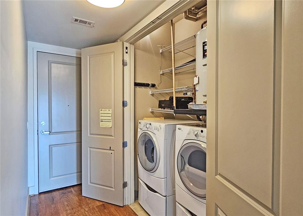 4561 Olde Perimeter Way, Unit 704 Atlanta, GA 30346 - Photo 20 of 45 a view of walk in closet