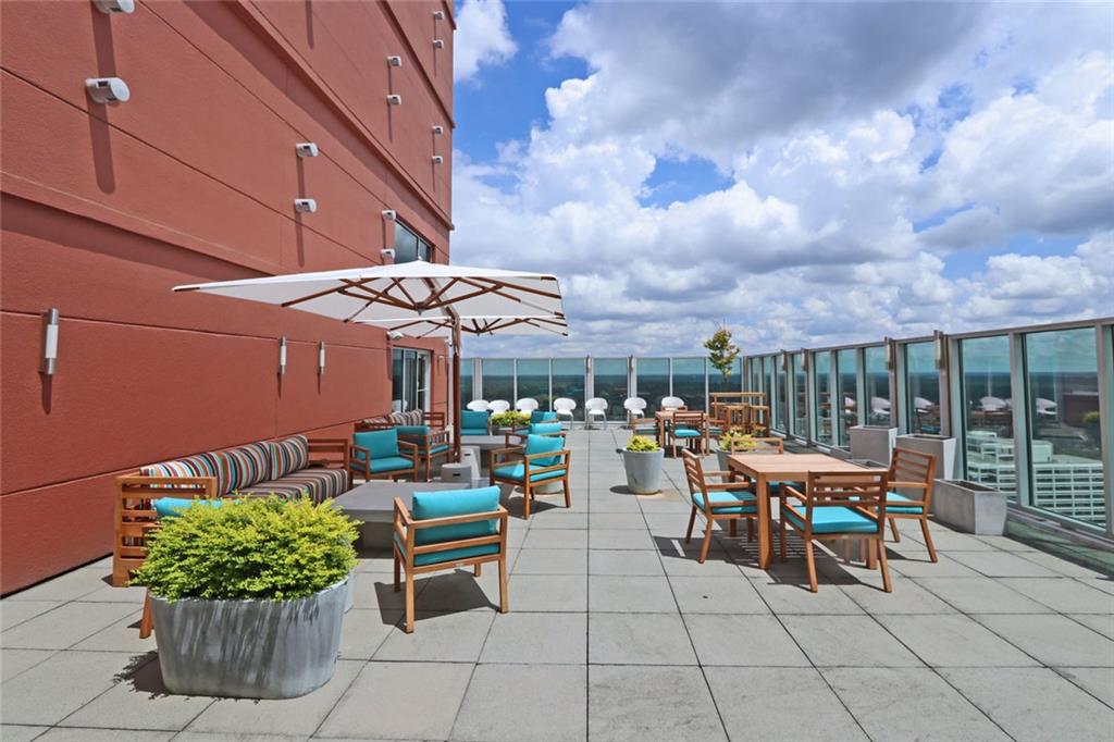 4561 Olde Perimeter Way, Unit 704 Atlanta, GA 30346 - Photo 37 of 45 a outdoor space with lots of tables and chairs