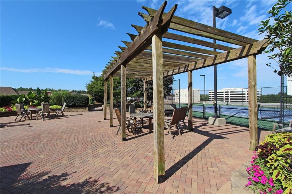 4561 Olde Perimeter Way, Unit 704 Atlanta, GA 30346 - Photo 42 of 45 a view of a backyard with sitting area