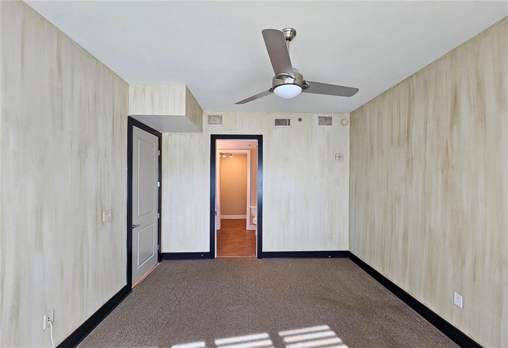 4561 Olde Perimeter Way, Unit 704 Atlanta, GA 30346 - Photo 10 of 45 a view of an empty room and a window