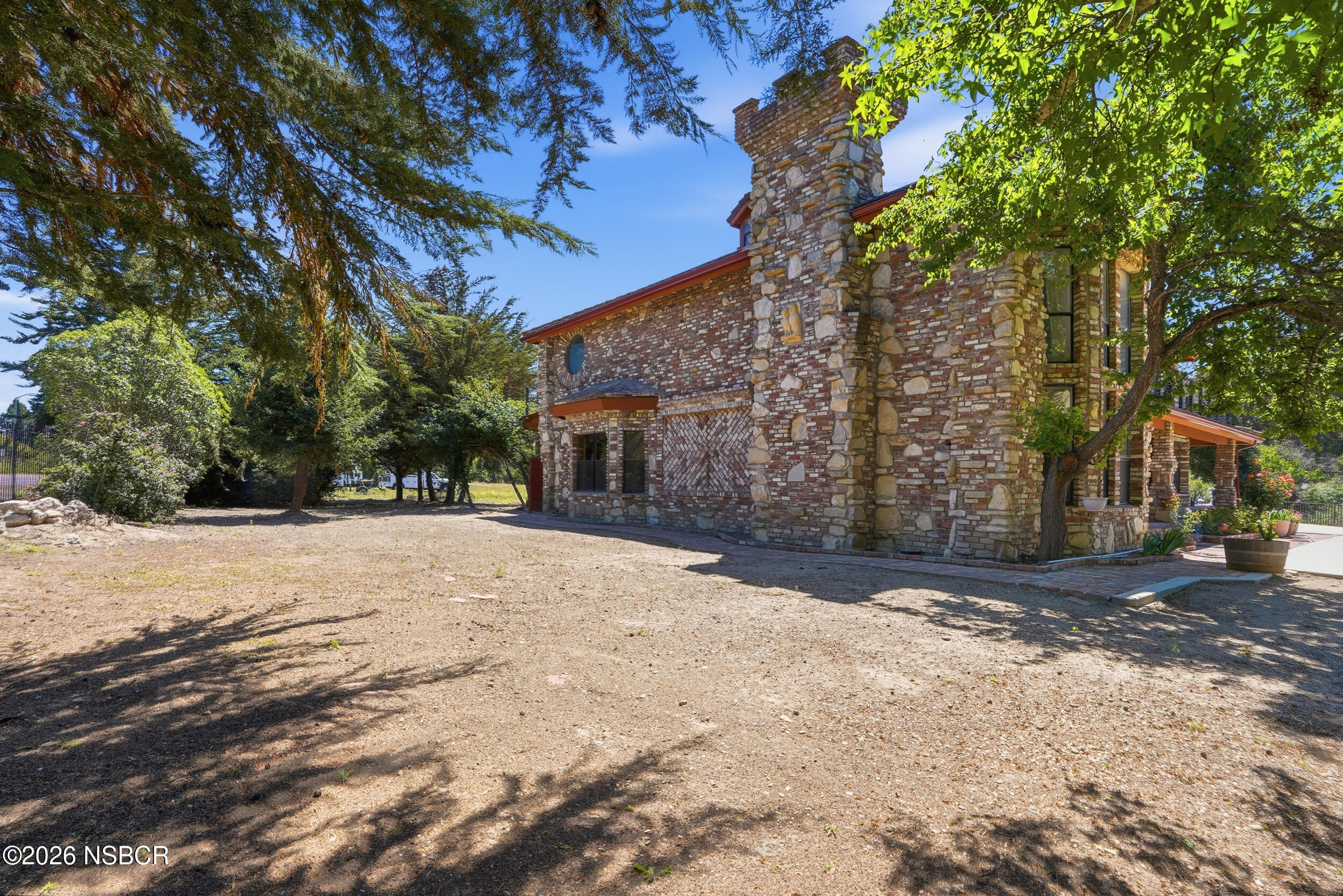 140 East Rice Ranch Road Santa Maria, CA 93455 - Photo 35 of 44 a front view of a house with a yard and garage