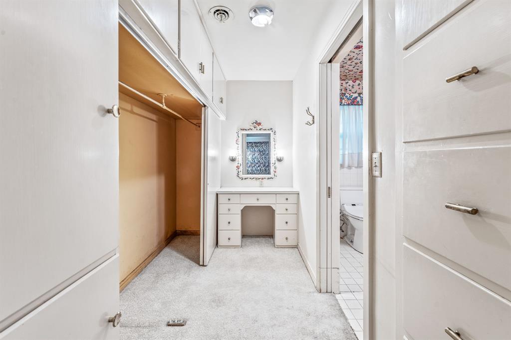 1222 Kentucky Street Graham, TX 76450 - Photo 22 of 37 a view of a bedroom with closet and wooden floor