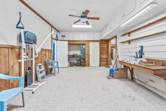 a view of a livingroom with furniture and a ceiling fan