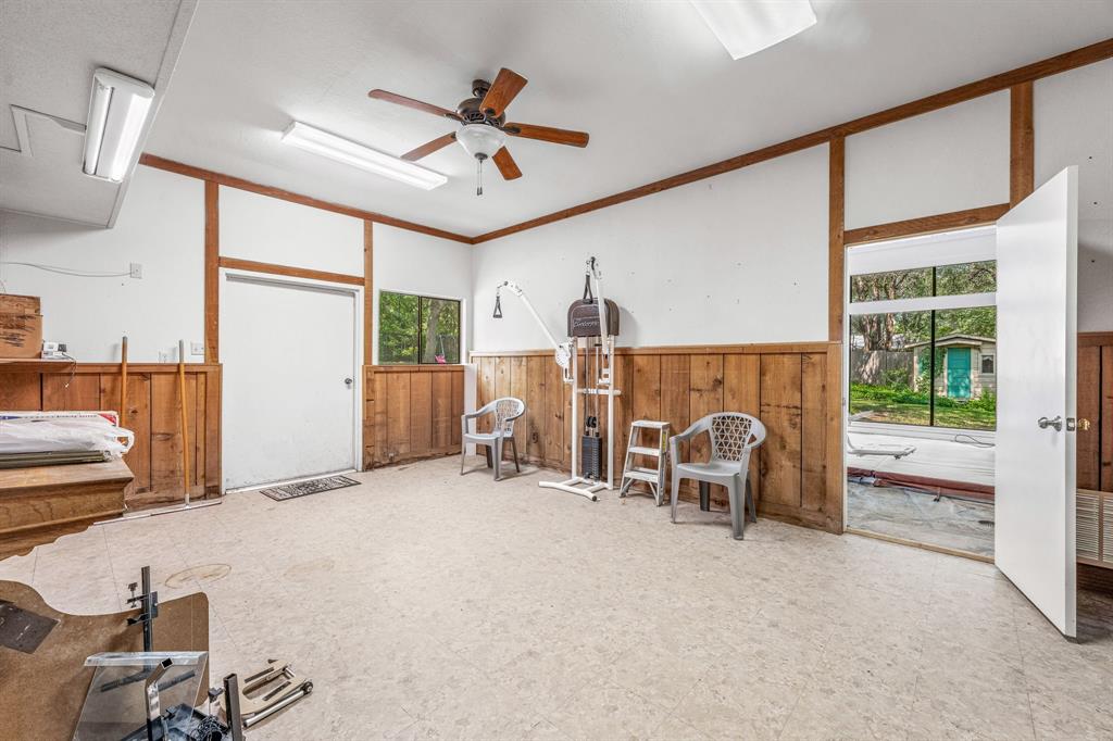 1222 Kentucky Street Graham, TX 76450 - Photo 30 of 37 a view of a livingroom with furniture and a ceiling fan