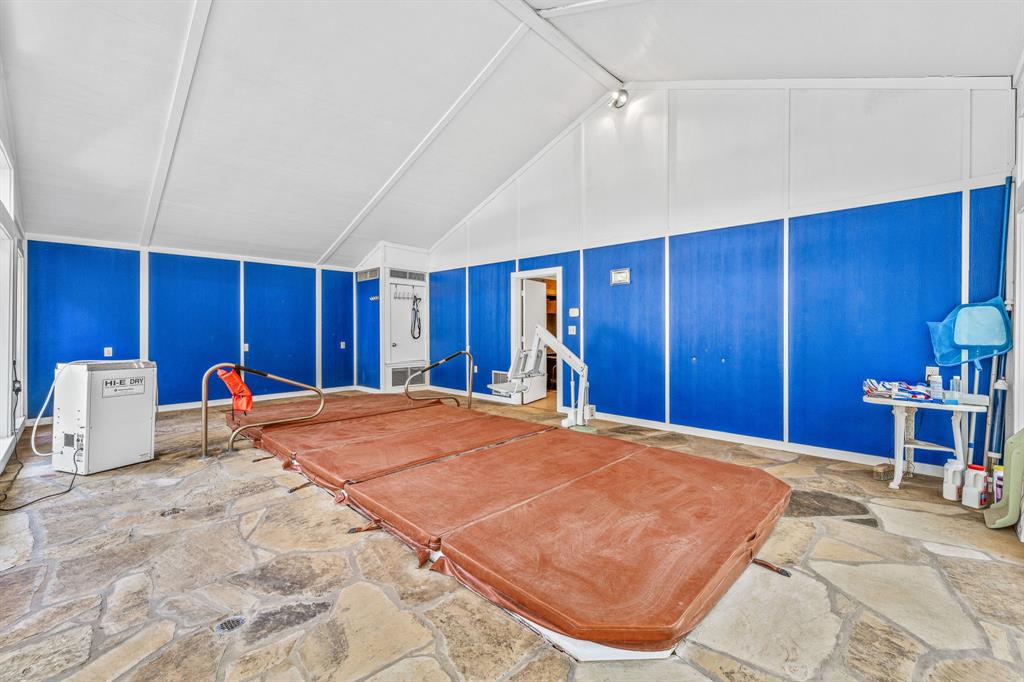 1222 Kentucky Street Graham, TX 76450 - Photo 31 of 37 a bed room with a bed and a table