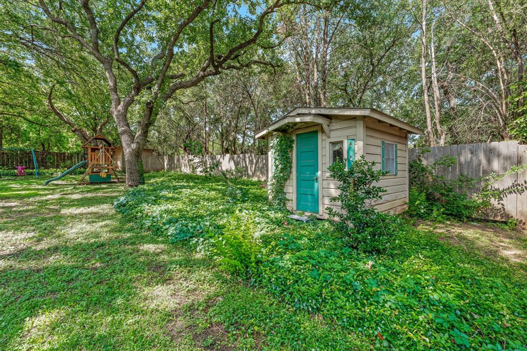 1222 Kentucky Street Graham, TX 76450 - Photo 32 of 37 a front view of a house with garden