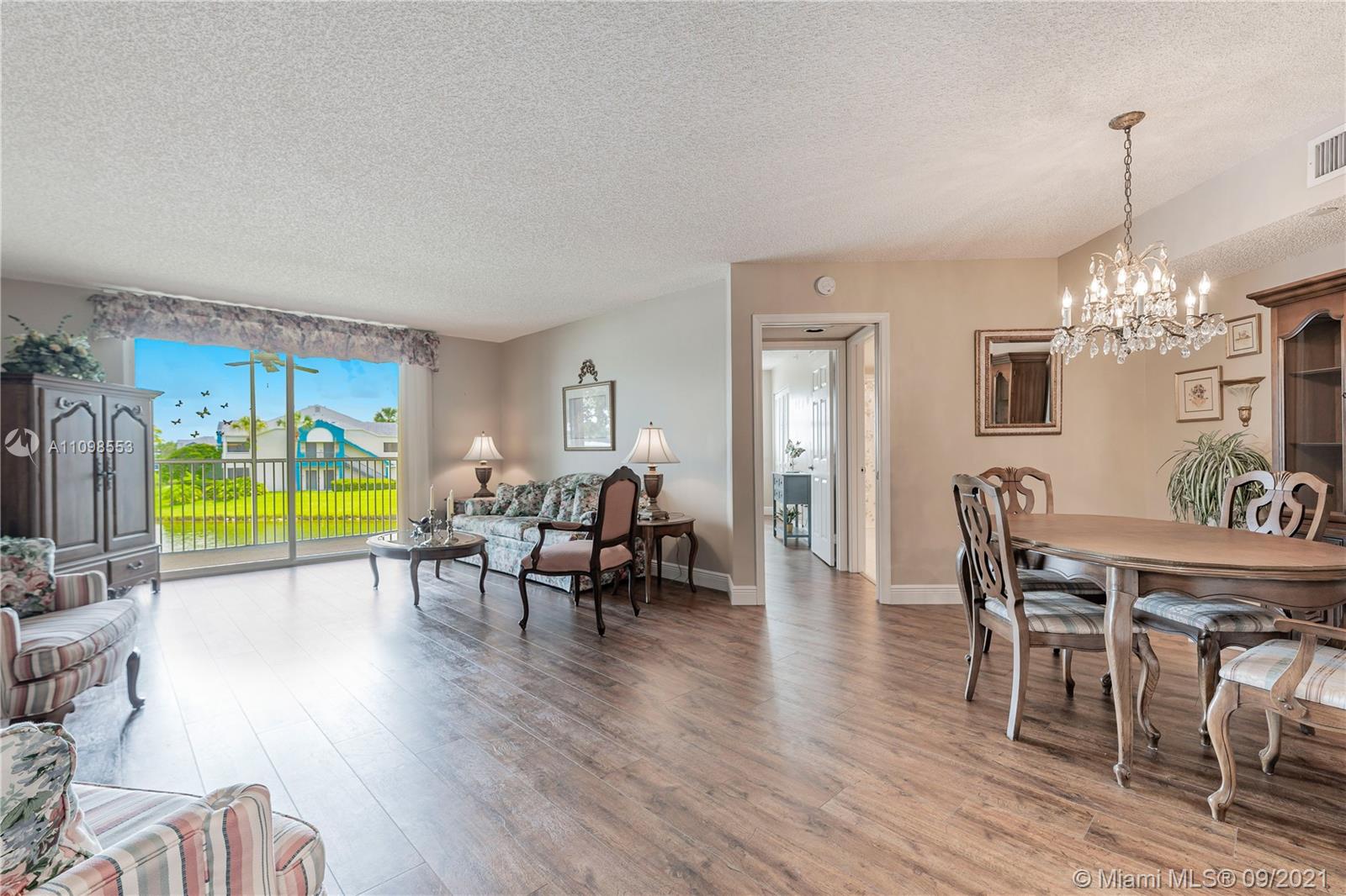 9563 Weldon Circle, Unit D207 Tamarac, FL 33321 - Photo 19 of 40 a view of a dining room with furniture window and outside view