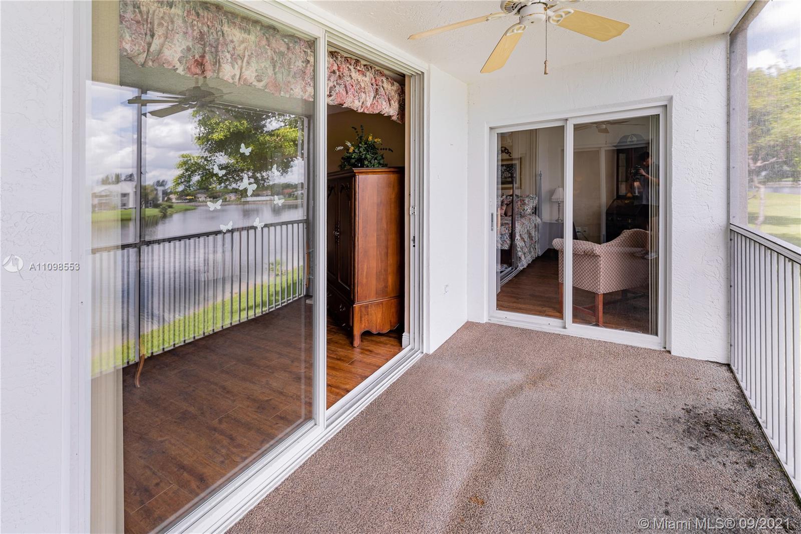 9563 Weldon Circle, Unit D207 Tamarac, FL 33321 - Photo 36 of 40 a view of a hallway with interior of the house