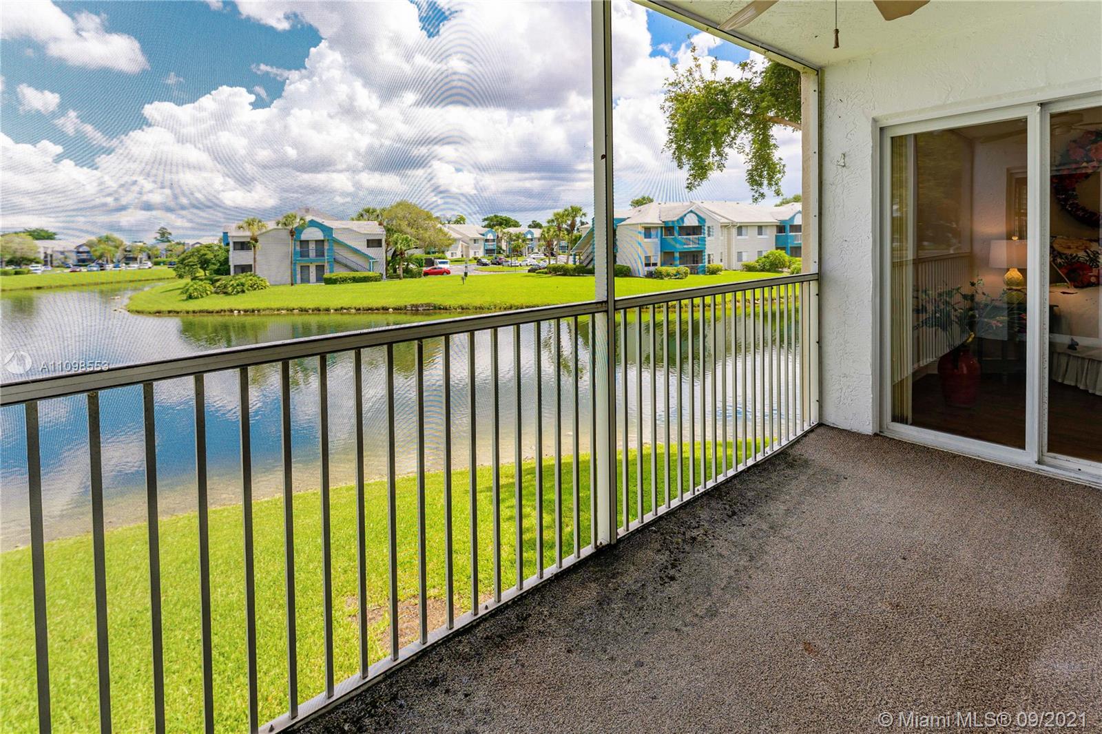 9563 Weldon Circle, Unit D207 Tamarac, FL 33321 - Photo 37 of 40 a view of a balcony with an outdoor space