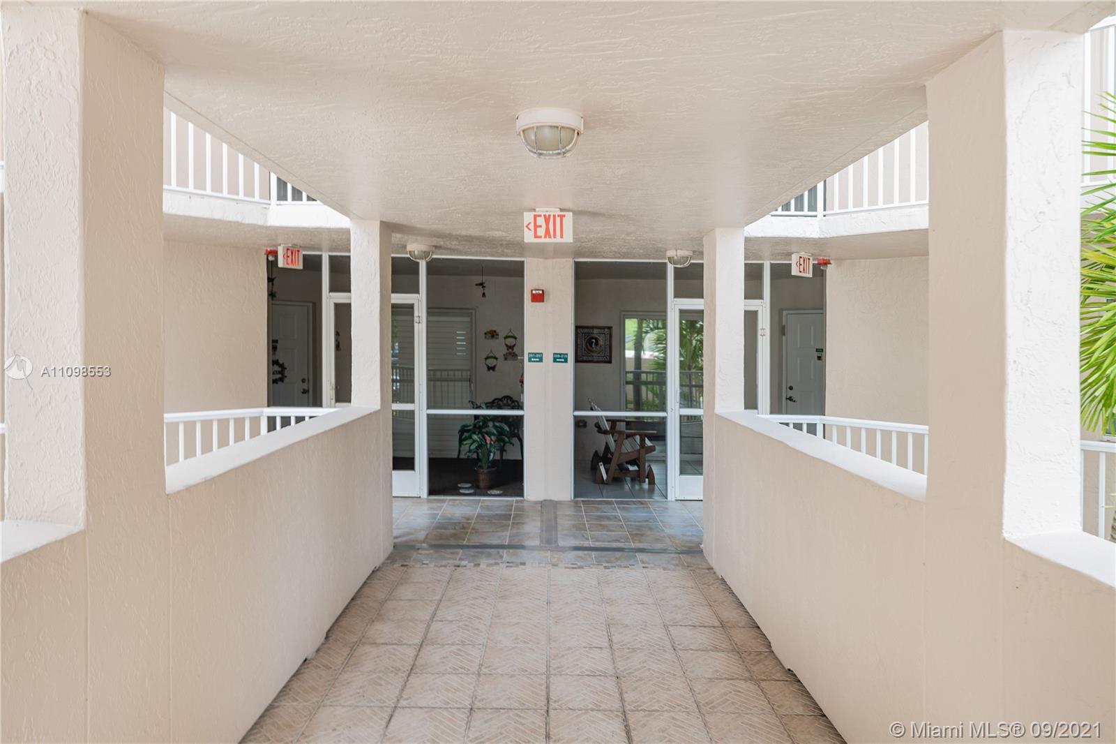 9563 Weldon Circle, Unit D207 Tamarac, FL 33321 - Photo 38 of 40 a view of hallway with stairs