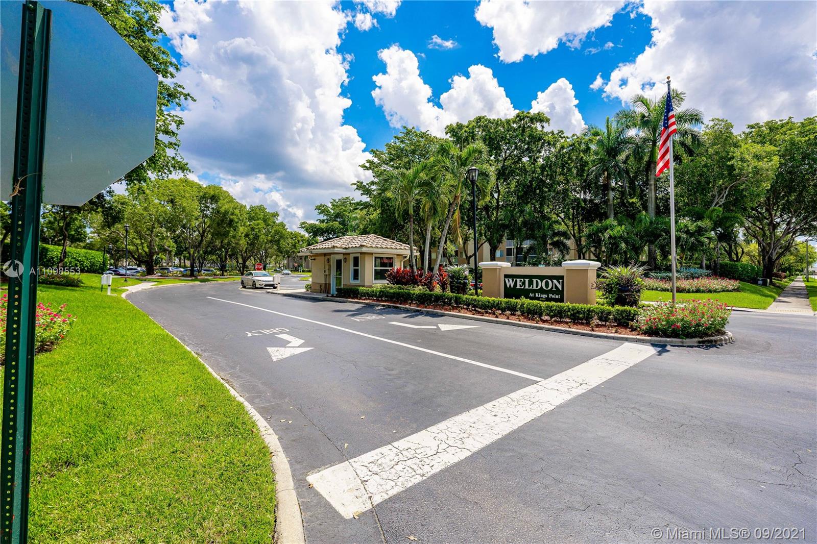 9563 Weldon Circle, Unit D207 Tamarac, FL 33321 - Photo 8 of 40 a view of a street with houses