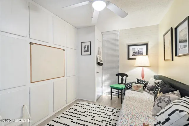 a bedroom with furniture and a window