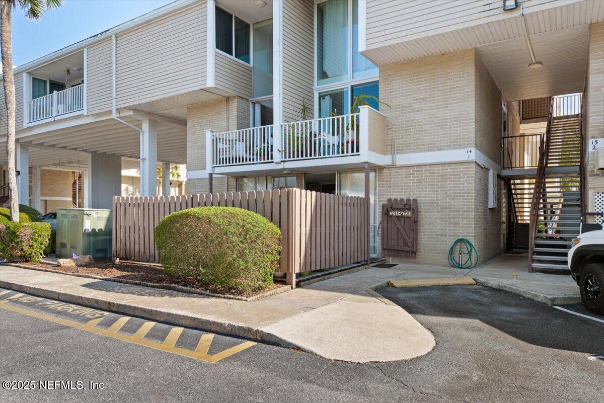 901 Ocean Boulevard, Unit 1 Atlantic Beach, FL 32233 - Photo 3 of 39 a view of a brick house with many windows