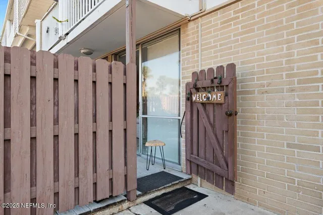 a view of a wooden door with a glass door